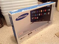 Sealed retail box showing Samsung logo and Smart TV branding