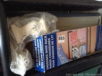 Underbed shoe rack in original box.