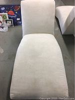 Front view of the off-white Michele Gold cigarette chair showing the smooth suede-like upholstery and width of the seating area.