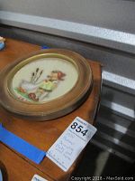 Overall view of the 1974 Hummel decorative plate in the wood frame showing the full item and note card.