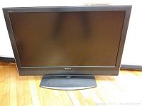 Front view of Sony Bravia 39 inch flat screen TV showing screen and stand.