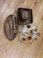 Wooden chip and dip tray with matching utensils, four square wooden bowls stacked, glass bowl with leaf design and smaller attached dip bowl