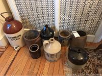Group shot of all eight vessels arranged on hardwood floor