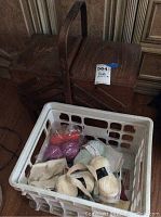 Wooden sewing basket/box with hinged compartments and double handle, dark wood finish, showing surface wear on top and legs