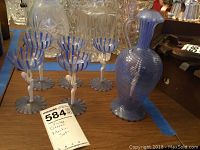 Group shot showing all five glasses and matching pitcher on table