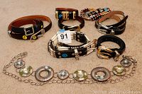 Overview of 9 belts showing various styles including leather and chain belt with turquoise accents