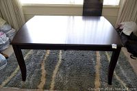 Front view of assembled table without leaf showing tabletop finish and overall form