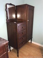 Front view of antique chiffonobe showing four drawers, side cabinet and attached mirror