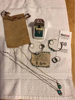 Complete jewelry lot including ring in box, bracelets, rings, necklaces, pouch and certificate card.