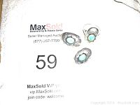 Clear image of sterling silver clip-on turquoise earrings showing design and stone inlay.