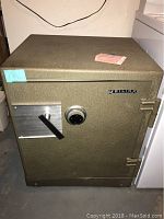 Front view showing the safe's combo dial, handle, and Meilink brand name on the door.