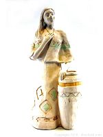 Front view of the large vintage Native American sculpture showing full figure and drum with painted geometric designs.