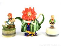 Three vintage figurines shown together on a white background.