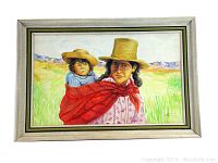 Framed oil painting showing a woman wearing a red shawl carrying a child on her back in a grassy field with mountains in background.