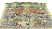 Tapestry laid out flat showing full size and design with yellow fringed edges and multicolored traditional Asian scenes.