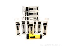 Lot of 10 Westward waterproof flashlights in original retail boxes. One flashlight displayed outside box is yellow with black accents and side switch.