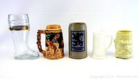 Front view of 5 vintage beer drinking steins and glasses showing details and condition.