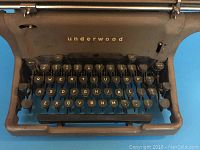 Close-up of the keyboard showing QWERTY layout and Underwood branding on the front panel.