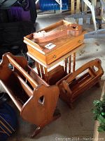 Wooden key holder, telephone table, and three wooden magazine racks in varying sizes with wood finish and visible wear