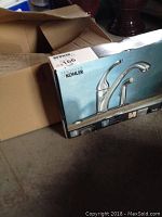 Photo showing the Kohler faucet box with the model and brand visible