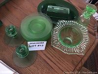 Overview of all glassware items on table, showing their relative sizes and shapes with note card