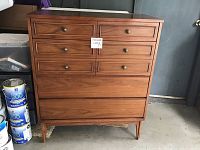 Front view of Dixie vintage wooden dresser showing six drawers and metal knob handles.