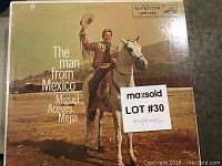 Cover of the LP record titled 'The Man from Mexico' featuring Miguel Aceves Mejia sitting on a horse, showing traditional Mexican attire and desert background.