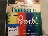 Photo of three vintage children's LP record covers: Pinocchio, Bambi, and Snow White by Disney, showing some age wear.