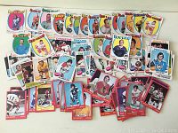 Photo showing a variety of hockey cards from different years mixed together. Cards show players from multiple NHL teams, mainly O-Pee-Chee brand from early 1970s.