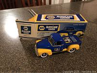 Photo of the die cast metal model pickup and its original box showcasing the NAPA Auto Care Center branding and limited edition label.