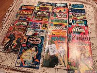 Stack of assorted Marvel comic books including Groo, Weird War, Alpha Flight, X-Men, Cloak and Dagger, and others