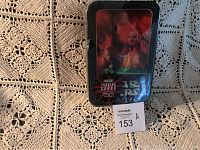 Metal tin with Star Wars character artwork on the lid, showing sealed condition with torn plastic wrap.