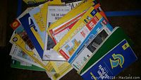 Stack of folded Michelin guide maps and assorted travel maps.