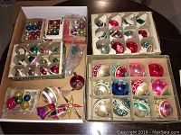 Overall lot showing multiple boxes of vintage blown glass Christmas ornaments in various colors and styles.