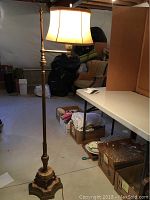 Full view of the antique brass and marble floor lamp standing 58 inches tall with cream fabric shade.