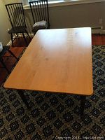 Top view showing the solid maple wood rectangular tabletop with smooth finish.