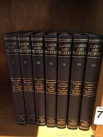 Seven volumes of Lands and People series in black hardcovers with gold embossing, titles showing regions and volume numbers.