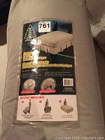 Photo showing the front of the packaging highlighting the Woods brand and product description of queen size B.Y.O. bed with memory foam