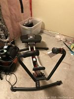 Front view of Pro Form AB Glider exercise machine showing the frame, padded seat, and handlebars.