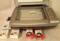 Top view of Lexmark X3150 flatbed scanner with ink cartridges placed on top.