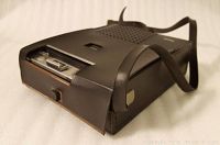 Photo showing the black carrying case for the cassette recorder with strap and flap