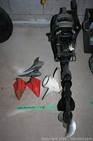 Overall view of Mercury outboard motor with accessory props and floats