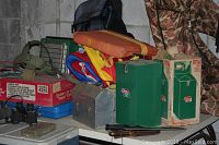 Table surface with boxes, knives and coolers