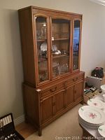 Full view of Drexel buffet and hutch showing wood construction, glass doors on hutch, and drawers and cabinets below.