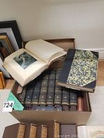 Box of 10 volumes of 'The Masterpieces and History of Literature' with dark blue-marbled hardcovers, gold text on spines and wear signs; also includes additional antique books with varied bindings.