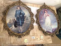 Pair of ornate vintage oval frames side by side showing Boy Blue and Miss Pinkie Pinky prints with a wooden background.