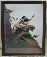Full framed print showing woman riding saber-toothed cat with spear and natural landscape background, wood frame present with minor nicks.