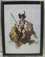 Full view of framed 1977 Frank Frazetta fantasy print featuring a female warrior and two big cats.