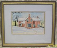 Framed watercolour painting showing the full artwork and frame, depicting a brown house in a snowy landscape with trees.