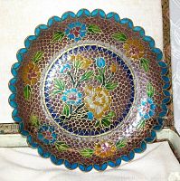 Top view of the cloisonné enamel glass plate showing detailed floral patterns and scalloped turquoise edge